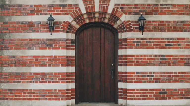 How To Refinish An Oak Front Door A Step By Step Guide   Oak Front Door Set In A Multicolored Brick Home 768x430 